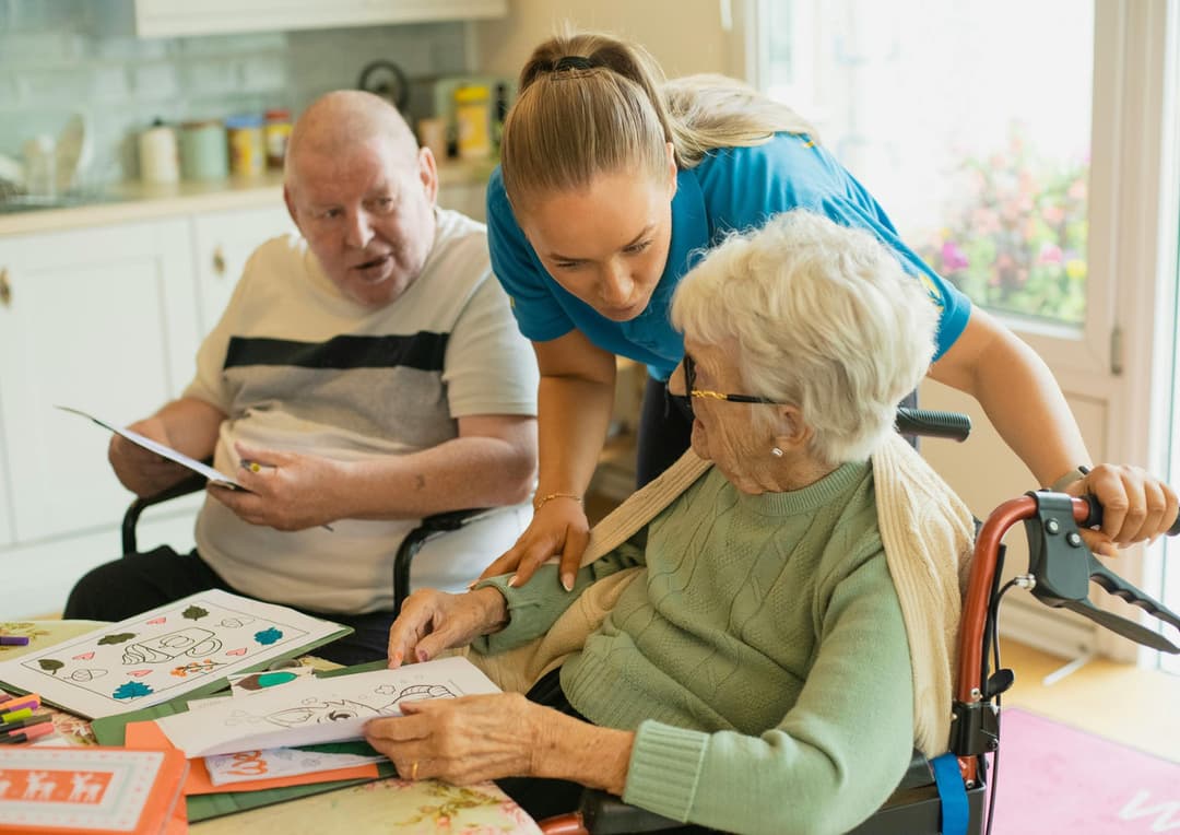 Caregiver holding senior hand